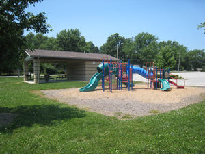 children's playground with slide at colman park - small shelter behind playground
