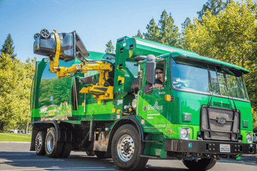City of Roseville garbage truck with driver and a toter