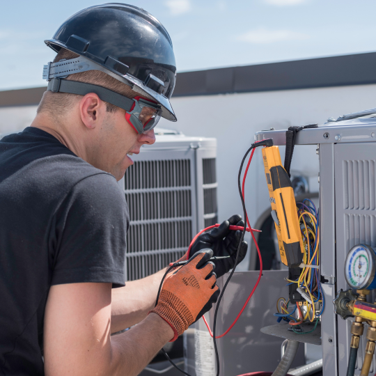 Man working on a commercial HVAC system